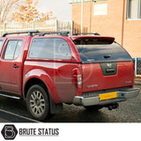 Rear view of a red Nissan Navara with a Truckman Grand Hardtop Canopy, featuring remote locking and pop-out windows, highlighting increased secure storage.