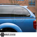 Nissan Navara 2005-2015 D40 Truckman Grand Hardtop Canopy with tinted windows, roof rails, spoiler, and remote locking, enhancing storage and security.