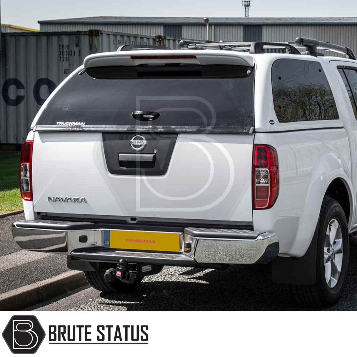 Nissan Navara 2005-2015 D40 Truckman Grand Hardtop Canopy with remote locking, featuring a cab-high design, tinted rear window, and chrome bumper with integrated tow hitch.