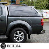 Rear view of a grey Nissan Navara 2005-2015 D40 featuring a Truckman Grand Hardtop Canopy with remote locking and tinted windows, enhancing storage and security.