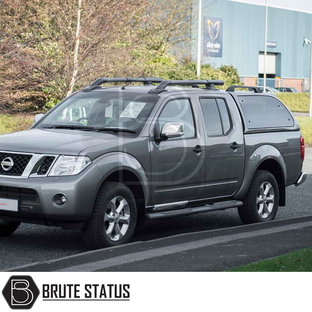 Nissan Navara 2005-2015 D40 Truckman Grand Hardtop Canopy with remote locking, featuring a sleek design and tinted windows, enhancing storage and security.
