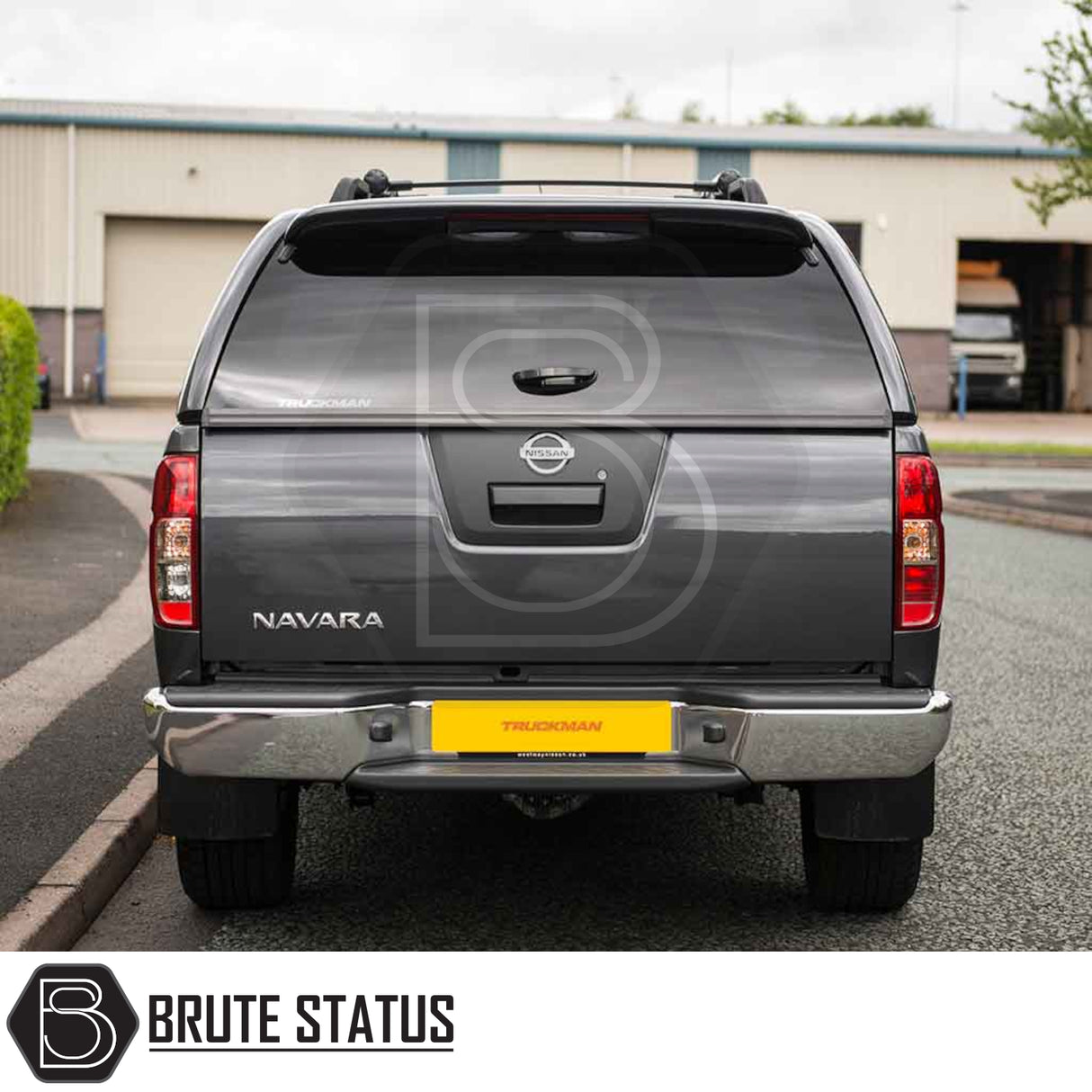 Nissan Navara 2005-2015 D40 with Truckman Grand Hardtop Canopy, featuring tinted windows and remote locking, enhancing storage and security.