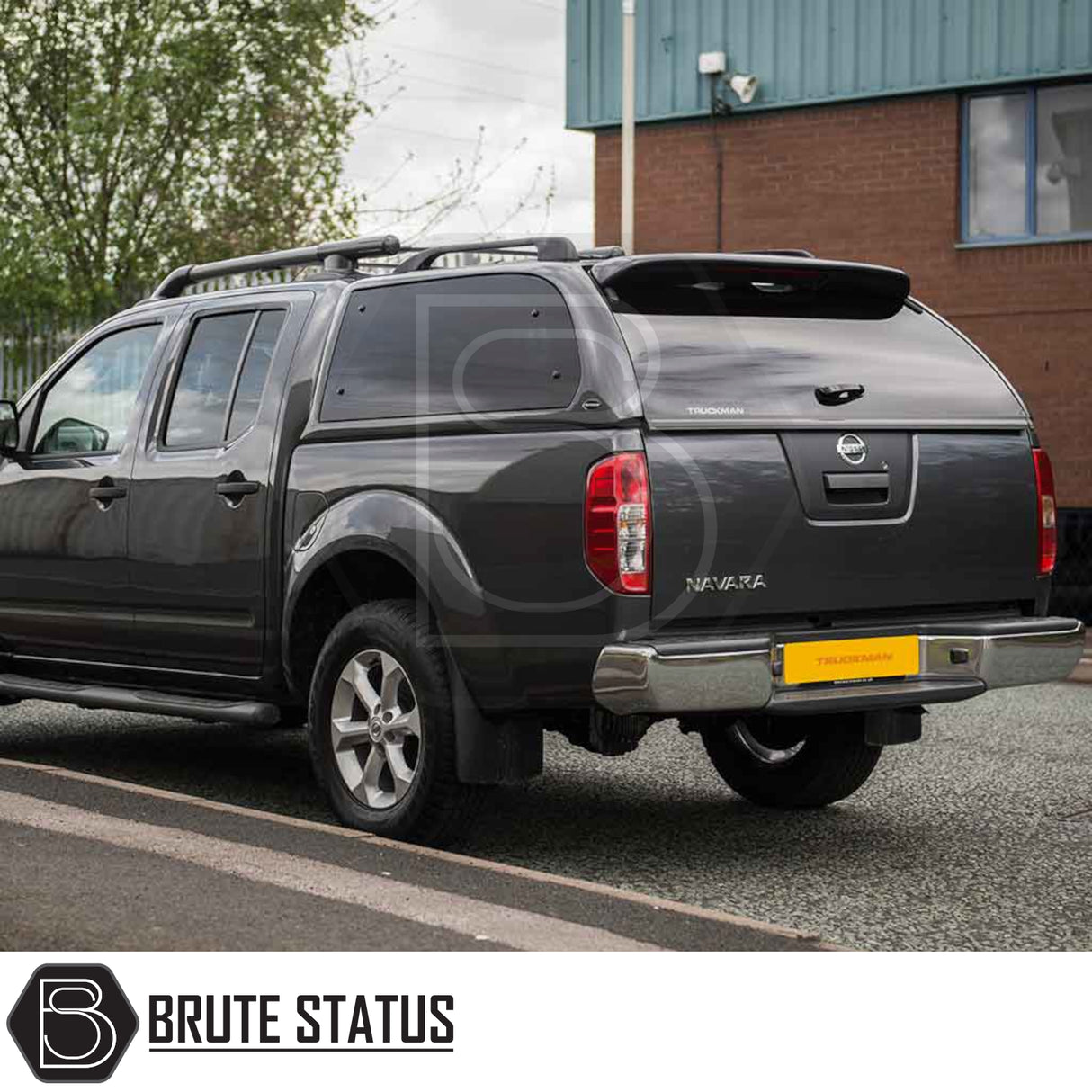 Nissan Navara 2005-2015 D40 Truckman Grand Hardtop Canopy with remote locking, featuring pop-out tinted windows and roof-rack, enhancing storage and security.