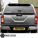 Nissan Navara 2005-2015 D40 Truckman Grand Hardtop Canopy showcases rear view with branded canopy, enhancing storage and security with remote locking and tinted windows.
