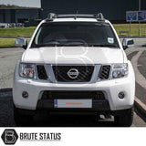 Nissan Navara 2005-2015 D40 with Truckman Grand Hardtop Canopy showcasing roof rack bars and branded accessories, enhancing storage and security for pick-up trucks.