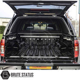 Rear view of Nissan Navara 2005-2015 D40 with open Truckman L-Series Hardtop Canopy, showcasing empty cargo bed and canopy features like remote locking and solid sides.