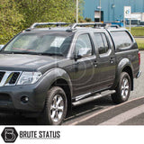 Nissan Navara 2005-2015 D40 Truckman L-Series Hardtop Canopy with remote locking, enhancing security and storage, parked in front of an industrial building.