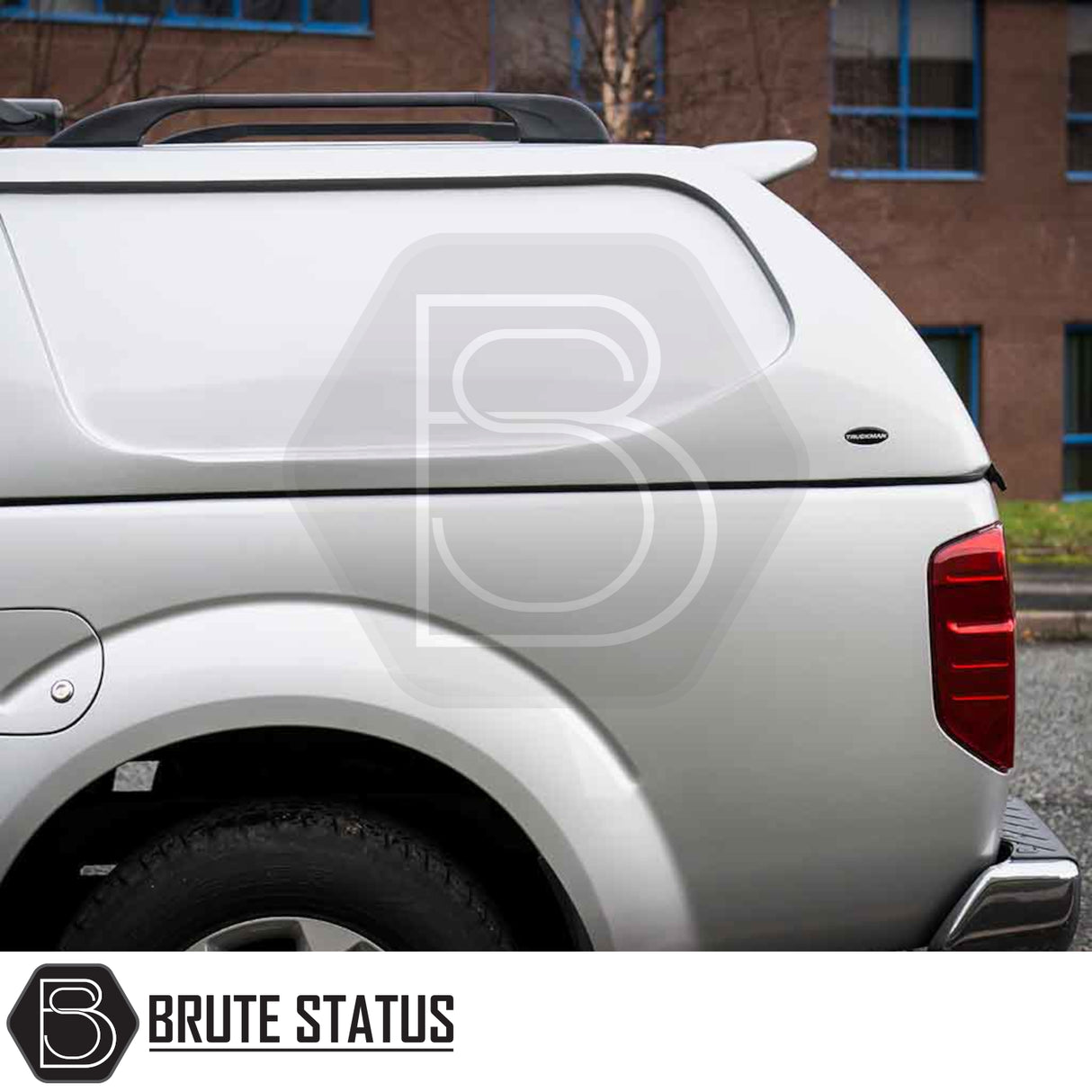 Silver Nissan Navara D40 with Truckman L-Series Hardtop Canopy, showcasing remote locking and sleek design for enhanced security and style.