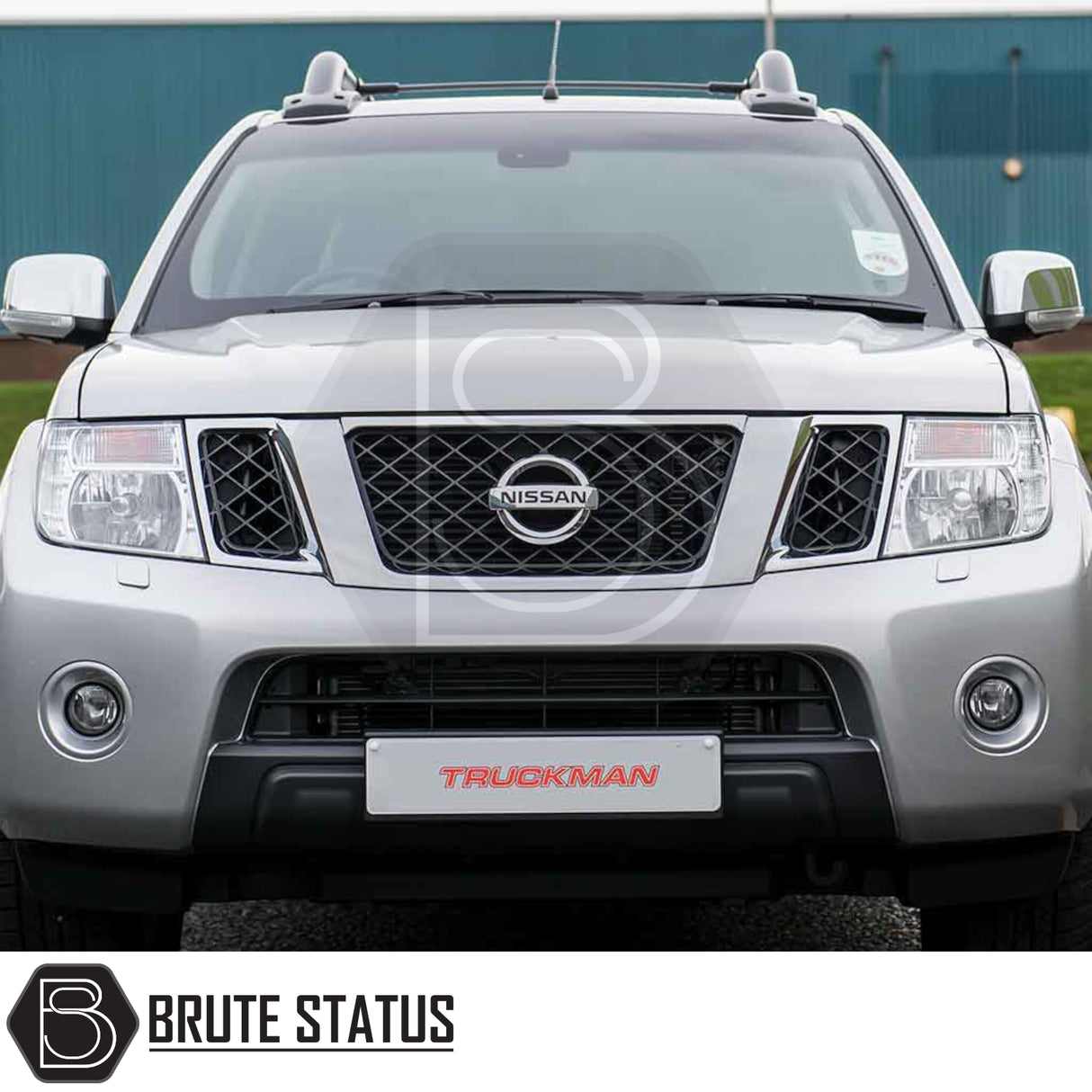 Silver Nissan pickup with Truckman L-Series hardtop canopy, roof rack, and custom plate; enhances security and storage, ideal for tradespeople.