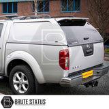 Silver Nissan Navara D40 with Truckman L-Series hardtop canopy, featuring seamless design and remote locking, enhancing truck bed security and storage.
