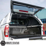 Nissan Navara 2005-2015 D40 Truckman L-Series Hardtop Canopy, open rear view with raised hatch, showcasing carpet-lined cargo space under lockable canopy.