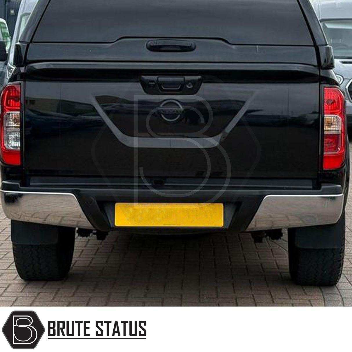 Chrome rear bumper for Nissan Navara NP300 2015–2022 with one parking sensor hole per side and step pads. 