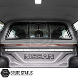 Nissan Navara 2015-2023 NP300 Truckman GLS Hardtop Canopy with remote locking, showing bed liner, tie-down rail, sliding window, interior dome light, and Brute Status branding.