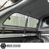 Interior of Nissan Navara 2015-2023 NP300 Truckman GLS Hardtop Canopy showing roofliner, side window, and adjustable aluminum mounting rails.