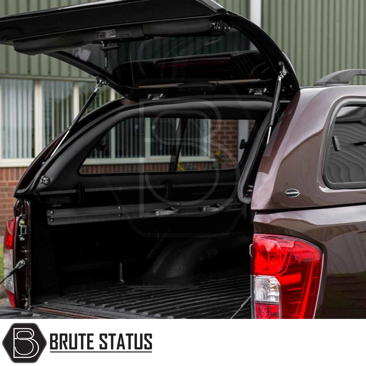 Nissan Navara 2015-2023 NP300 Truckman GLS Hardtop Canopy with open tailgate, showcasing cargo space and the Brute Status logo, highlighting remote locking and ventilation features.