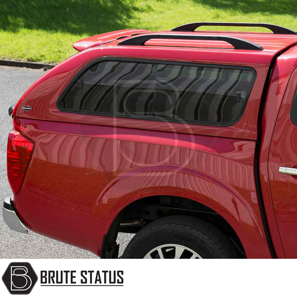 Rear view of a Nissan Navara NP300 with a Truckman GLS Hardtop Canopy featuring tinted windows, roof rails, and “Brute Status” logo watermark.