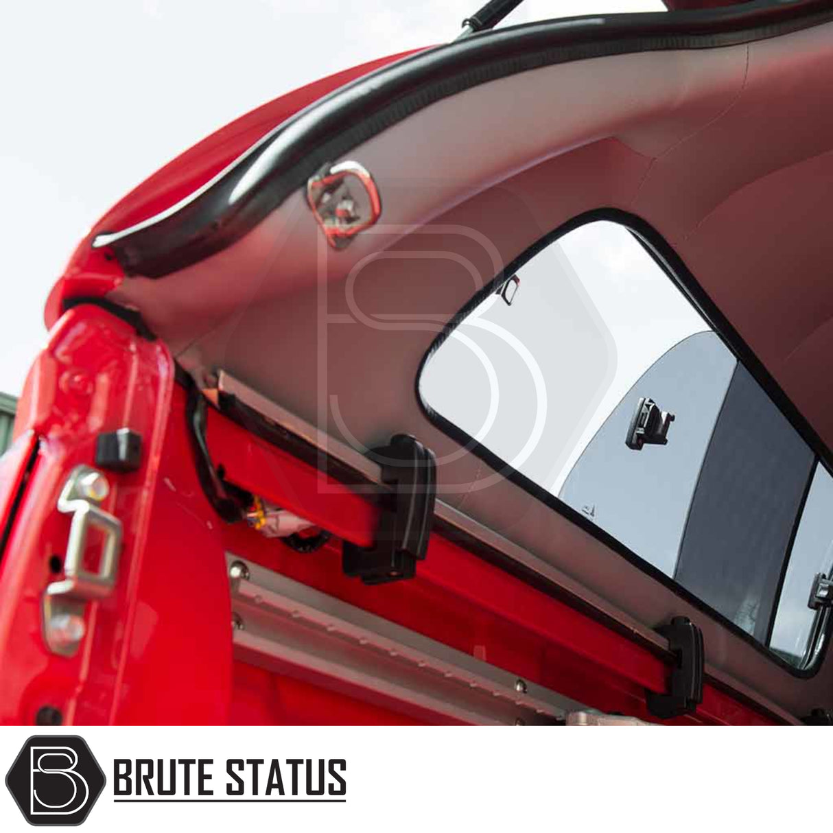 Nissan Navara Truckman GLS canopy with flipped-up hard tonneau cover, showcasing mounting rails, clamps, and rear sliding window for secure, stylish truck customization.