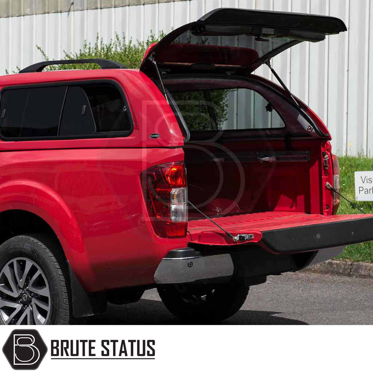 Red Nissan Navara 2015-2023 NP300 with Truckman GLS hardtop canopy, featuring open rear hatch and tailgate, showcasing the enhanced cargo space and sleek design.