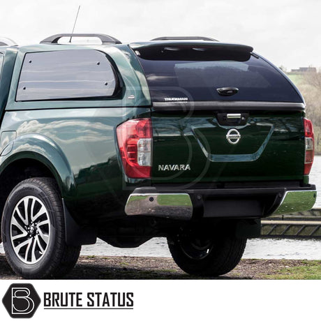 Nissan Navara 2015-2023 NP300 Truckman Grand Hardtop Canopy with remote locking, showcasing sleek design and enhanced storage on a dark-green pickup truck.