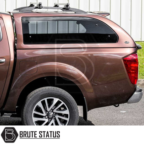 Nissan Navara NP300 Truckman Grand hardtop canopy with remote locking, showcasing tinted windows, roof rack, and alloy wheel, enhancing storage and security.