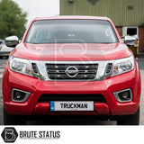 Front view of a red Nissan pickup with Truckman Grand Hardtop Canopy featuring remote locking and tinted windows, branded by Brute Status.