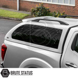Silver Nissan Navara with Truckman Grand Canopy, featuring pop-out tinted windows, roof rails, and remote locking, enhancing storage and security.