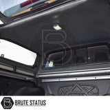 Nissan Navara 2015-2023 NP300 Truckman Grand Hardtop Canopy under camper shell, showing MAX Liners bed liner, side rails, dome light, and sliding rear window.