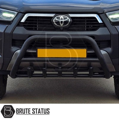 Matte black city bar fitted to a 2018–2021 SsangYong Musso, manufactured from durable carbon steel to enhance styling and provide bumper protection, featuring a TÜV-certified, no-drill, DIY installation using chassis-mounted U-brackets.