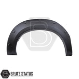 Toyota Hilux 2005–2011 wide wheel arch kit in a riveted fender-flare style. The kit includes textured black, UV-resistant plastic arches with decorative rivet bolts, adding about 65–70 mm of extra width per side. Designed for double-cab, pre-facelift Hilux models, the arches install with 3M adhesive and existing mounting points without drilling.