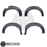 Toyota Hilux 2005–2011 wide wheel arch kit in a riveted fender-flare style. The kit includes textured black, UV-resistant plastic arches with decorative rivet bolts, adding about 65–70 mm of extra width per side. Designed for double-cab, pre-facelift Hilux models, the arches install with 3M adhesive and existing mounting points without drilling.