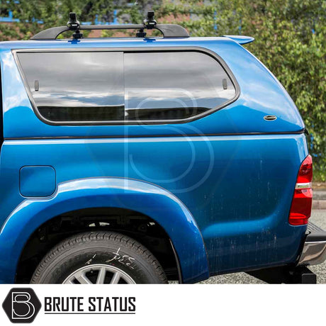 Toyota Hilux 2005-2016 Truckman GLS Hardtop Canopy with tinted windows, roof-rack crossbar, and remote locking, enhancing pickup storage and ventilation.