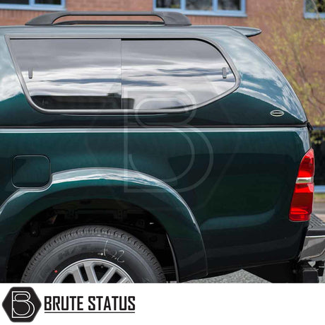 Toyota Hilux 2005-2016 MK6, MK7 Truckman GLS Hardtop Canopy, rear view with tinted side window, roof rails, and canopy logo badge.