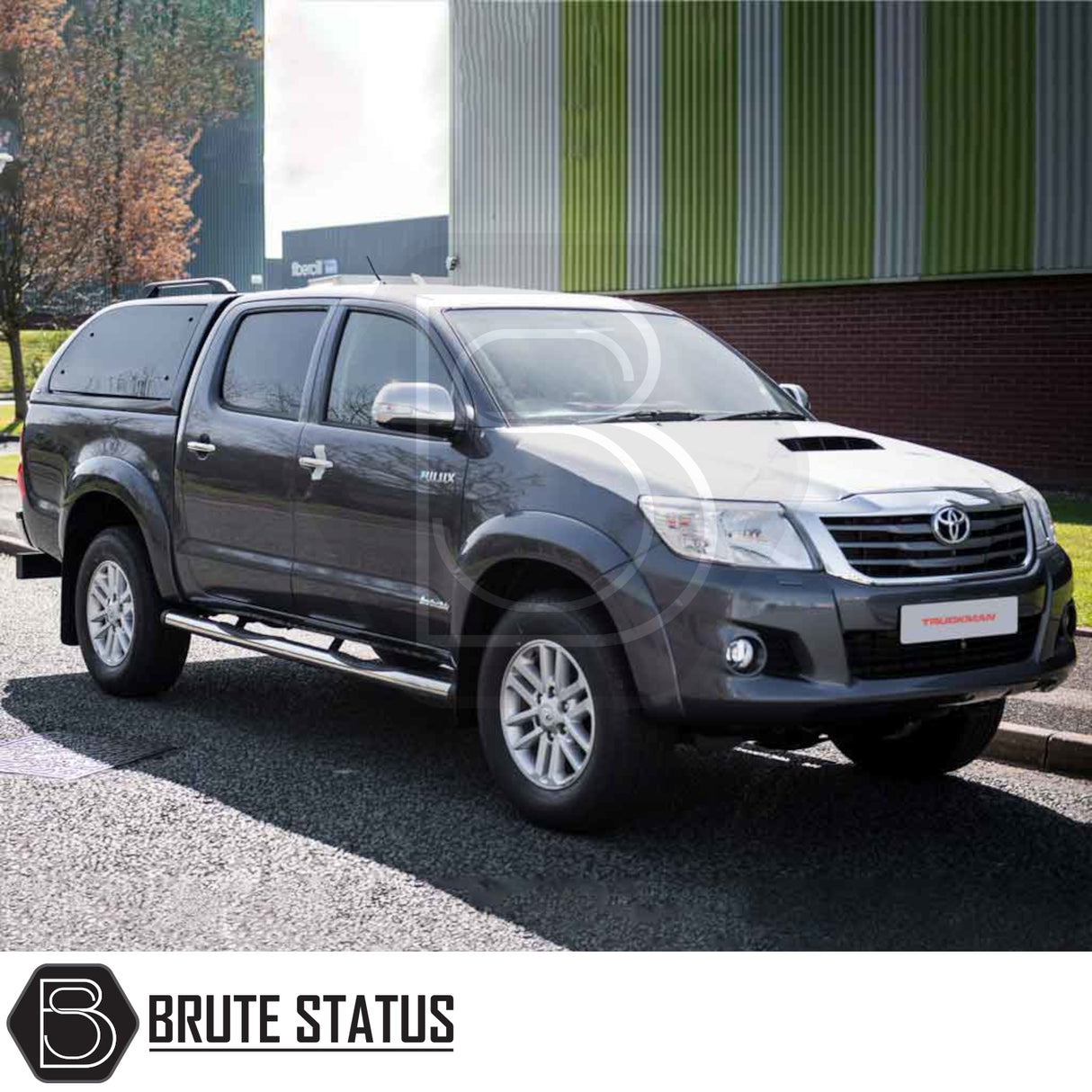 Toyota Hilux 2005-2016 Truckman Grand Hardtop Canopy with remote locking, featured on a double-cab, showcasing streamlined design and enhanced storage by Brute Status.