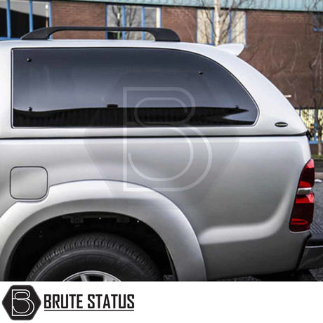Toyota Hilux 2005-2016 Truckman Grand Hardtop Canopy shown with tinted windows, enhancing security and style, featuring remote locking and pop-out ventilation.