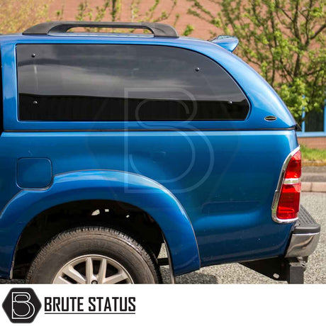 Toyota Hilux 2005-2016 Truckman Grand Hardtop Canopy features a stylish, tinted fiberglass design with remote locking, enhancing storage and security for your pickup truck.