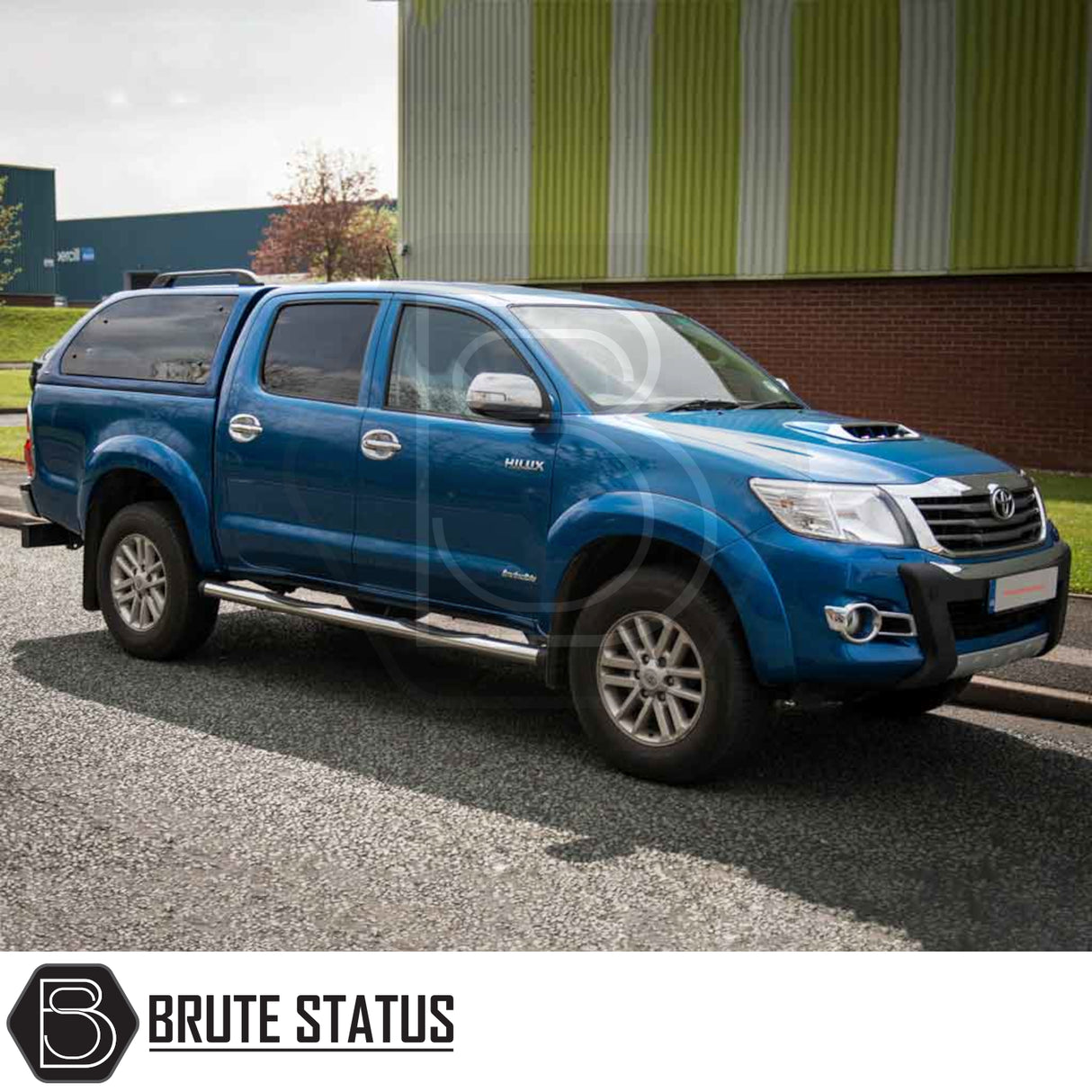 Toyota Hilux 2005-2016 MK6, MK7 Truckman Grand Hardtop Canopy with remote locking on a double-cab pickup, featuring tinted windows and a sleek, aerodynamic design.