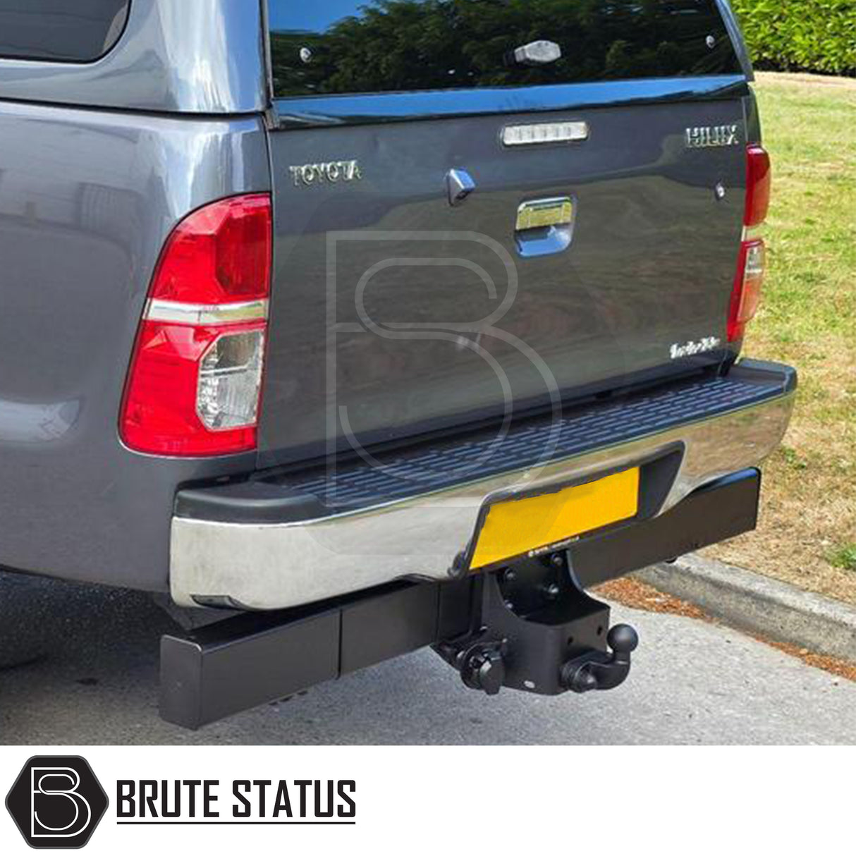 Chrome rear bumper for Toyota Hilux 2011–2014, featuring a factory-style finish, non-slip step pads with drainage channels, and direct bolt-on installation for enhanced durability and functionality