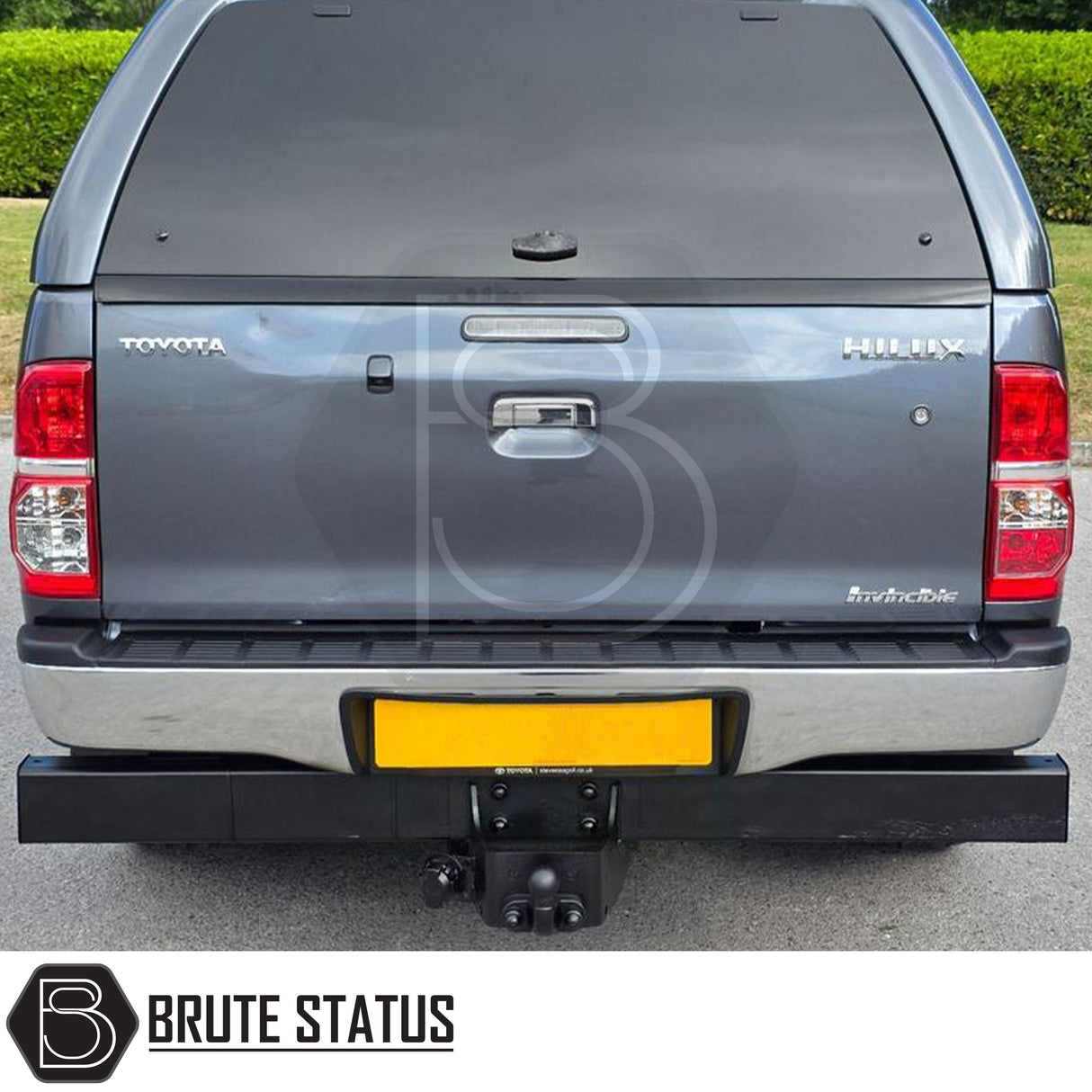 Chrome rear bumper for Toyota Hilux 2011–2014, featuring a factory-style finish, non-slip step pads with drainage channels, and direct bolt-on installation for enhanced durability and functionality