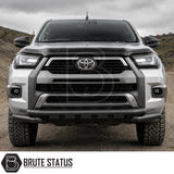 Front mounting heavy duty matte black powder coated nudge bar fitted to silver Toyota Hilux 2020+ pickup truck offroad 4x4 vehicle. 