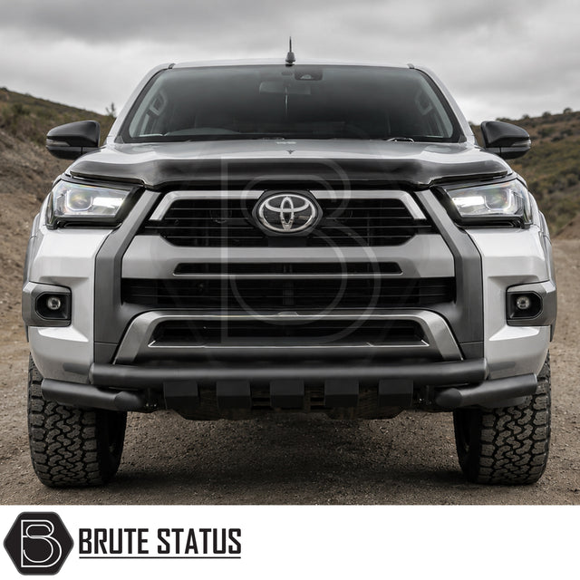 Front mounting heavy duty matte black powder coated nudge bar fitted to silver Toyota Hilux 2020+ pickup truck offroad 4x4 vehicle. 