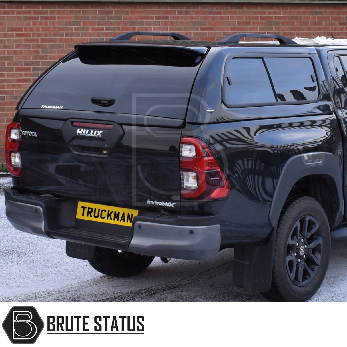 Toyota Hilux Invincible X with Truckman GLS hardtop canopy showcasing tinted windows and roof rails, ideal for enhancing truck storage and ventilation.