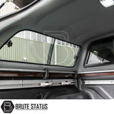 Toyota Hilux Invincible X Truckman GLS Canopy interior, showcasing cargo rails, sliding windows, molded headliner, and textured bed liner for secure gear management.