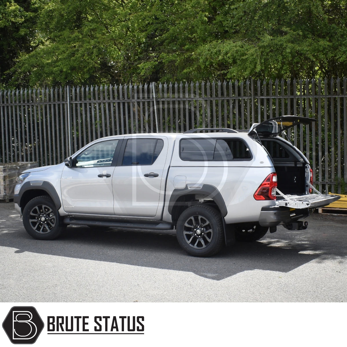 Toyota Hilux Invincible X with Truckman GLS Hardtop Canopy, featuring open rear hatch and tailgate, showcasing spacious, secure, and ventilated load area.