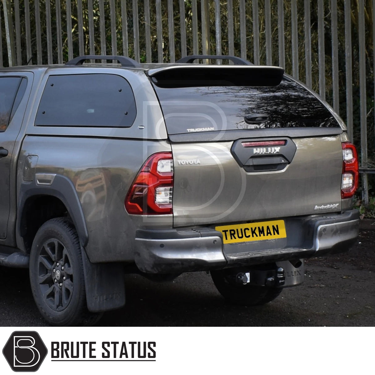 Toyota Hilux Invincible X 2016+ with Truckman Grand Hardtop Canopy featuring remote locking, tinted windows, roof-rack bars, and Brute Status tow hitch.