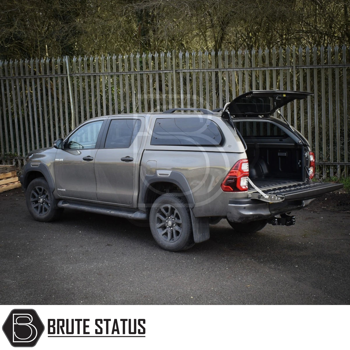 Toyota Hilux Invincible X 2016+ Truckman Grand Hardtop Canopy with open hatch showcases premium features like remote locking and tinted windows, enhancing pickup functionality.