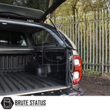 Toyota Hilux Invincible X Truckman Grand Hardtop Canopy with remote locking, open tailgate and canopy, showcasing ribbed bed-liner, gas struts, and Brute Status logo.