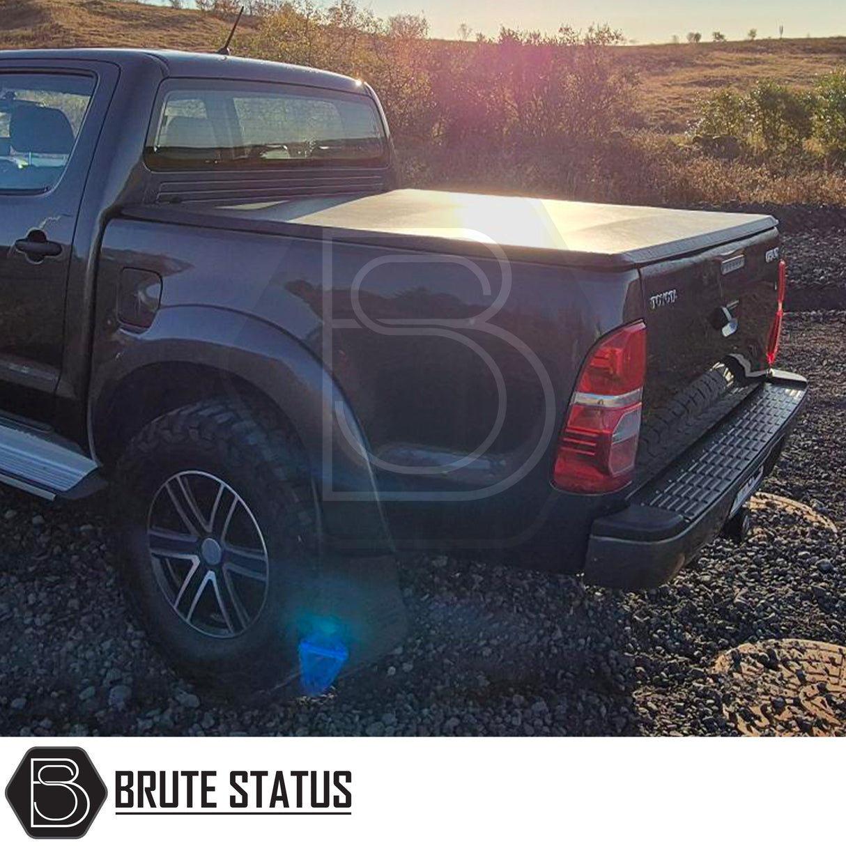 Toyota Hilux 2005-2014 Tonneau Cover, tri-fold design, enhances aerodynamics, UV-stable vinyl, aluminium securing catch, easy install, no drilling required.