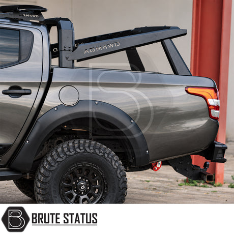 Universal S70 tent roll bar for pickup trucks with heavy duty carbon steel construction and matte black powder coated finish for roof tent mounting fitted onto L200. 