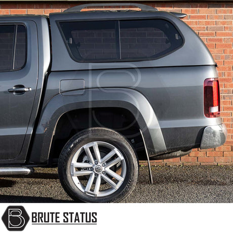 Volkswagen Amarok 2010-2022 Truckman GLS Hardtop Canopy with tinted, lockable sliding windows and remote locking, displayed with alloy wheel and mud flap.