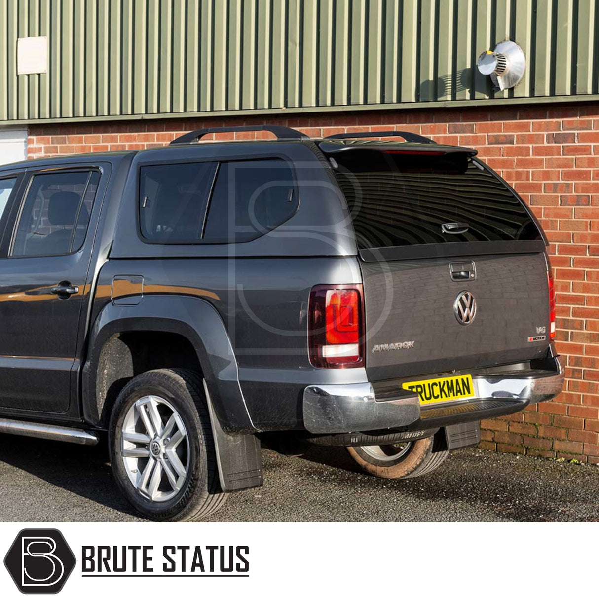 Volkswagen Amarok 2010-2022 Truckman GLS Hardtop Canopy with lockable sliding windows and remote locking, seen from rear three-quarter view. Brute Status logo visible.